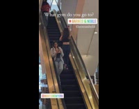 Woman works out in bookstore escalator 
