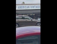 Woman lay on pink car vintage shop