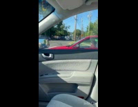 Submitter shows small man driving red car 