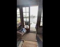 Houseboat tour black shirt girl wood patio 