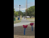 Man in black outfit tiktok dance at the park