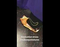 Guy wears orange plastic  fish sandals to his graduation