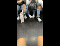 Three girls wear matching white crocs subway