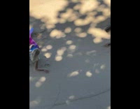 Blonde woman pink blue mermaid tail beach