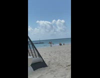 Woman pants hold cloth with spots beach