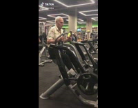 85 year old grandpa lifts weights at the gym 