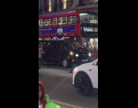 Woman black dress stand middle street traffic