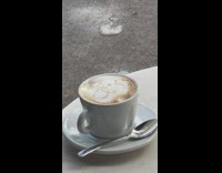 Woman drinks coffee with snowman on it 