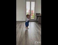 Baby dances while watching a music video