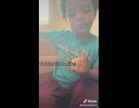 Little boy holds bug in hand