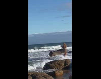 Woman black bikini sit beach waves pictorial