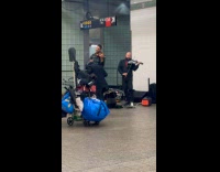 Man joins band dance at subway station