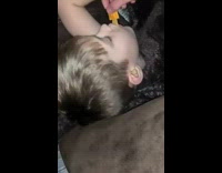 Stack items on sleeping kid boy 