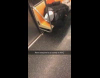 Guy sleeps on multiple seats on subway train
