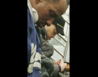 man asleep in blue jacket snot coming out of nose