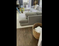 Boy leaning against pillow falls off couch 