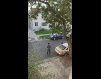 Man blue jersey dance street red car