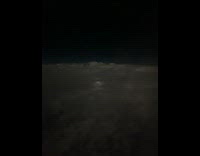 Lightning flash on storm clouds night flight