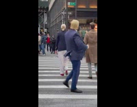 Guy in Trump mask directs traffic 