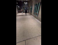 Collab WINY - Man black suit ride motorized luggage night