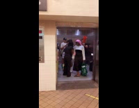 Guy plays saxophone with attached traffic cone