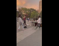 Guy balancing ball dances to guys playing drums 