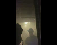 Crowded train filled with smoke from fire