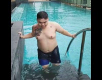 Big guy gets out of pool seductive
