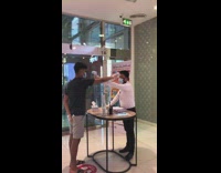 Security uses temperature gun on guy