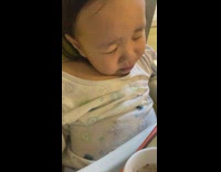 Kid sleeps while her mom feeds her 