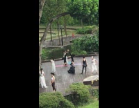 Two woman handstand feet touch yoga pose