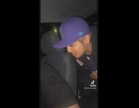 Collab BitchIG2 - Guy in car with green bandana and golden microphone on phone