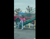 Girl pink jacket lean on motel stairs
