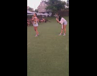 Girl holds brown dog fake grass umbrellas 