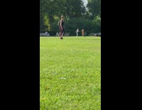 Woman in white top roller-skates at the park