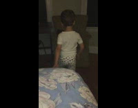 Little boy dancing to live music from tv