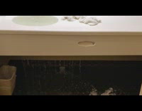 Hotel bathroom broken sink drain and leaks water 