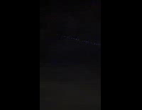 Strange lights lining up on night sky