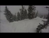 Guy frontflips on skis and faceplants into snow, gopro camera