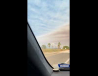 Blue and gray skies on the freeway