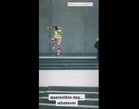 Guy wears safety vest and jester hat