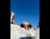 Man throws sand on kid 