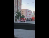 Woman white dress middle of street photoshoot 