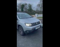 Dad picks up beer kegs while son sits in trunk