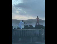 Woman pink bikini on hot spring bridge