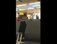 Two guys unsynchronized arm movements airport chairs