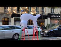 Polar bear inflatable float on the sidewalk