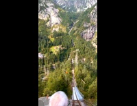 Two women rides the tall amusement ride