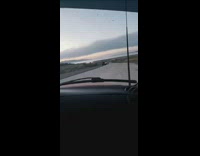 Red truck drives erratically off street guys