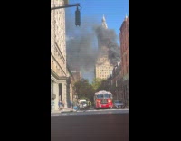 Firetruck reverse into street near rooftop fire